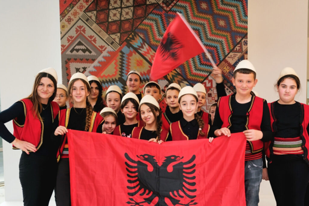 children wearing qeleshe