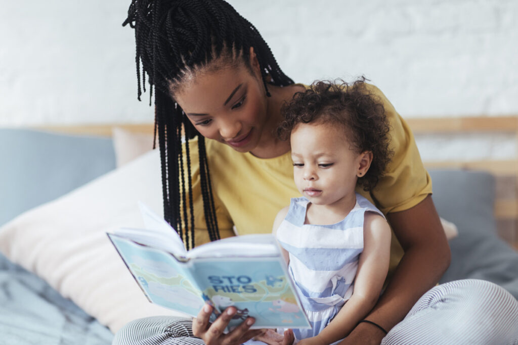woman reading to baby